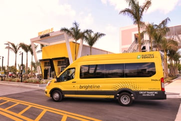 Brightline Electric Van parked in front of the Brightline Aventura Station