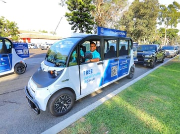 Driver smiling from a circuit vehicle