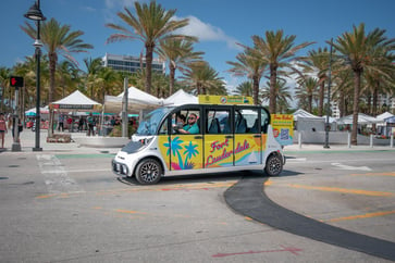 A circuit car driving with fort lauderdale branding