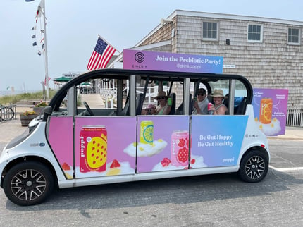 Poppi branded circuit car at East Hampton beach