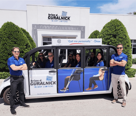 Brian D. Guralnick branded Circuit Shuttle in front of the Injury Lawyers Office